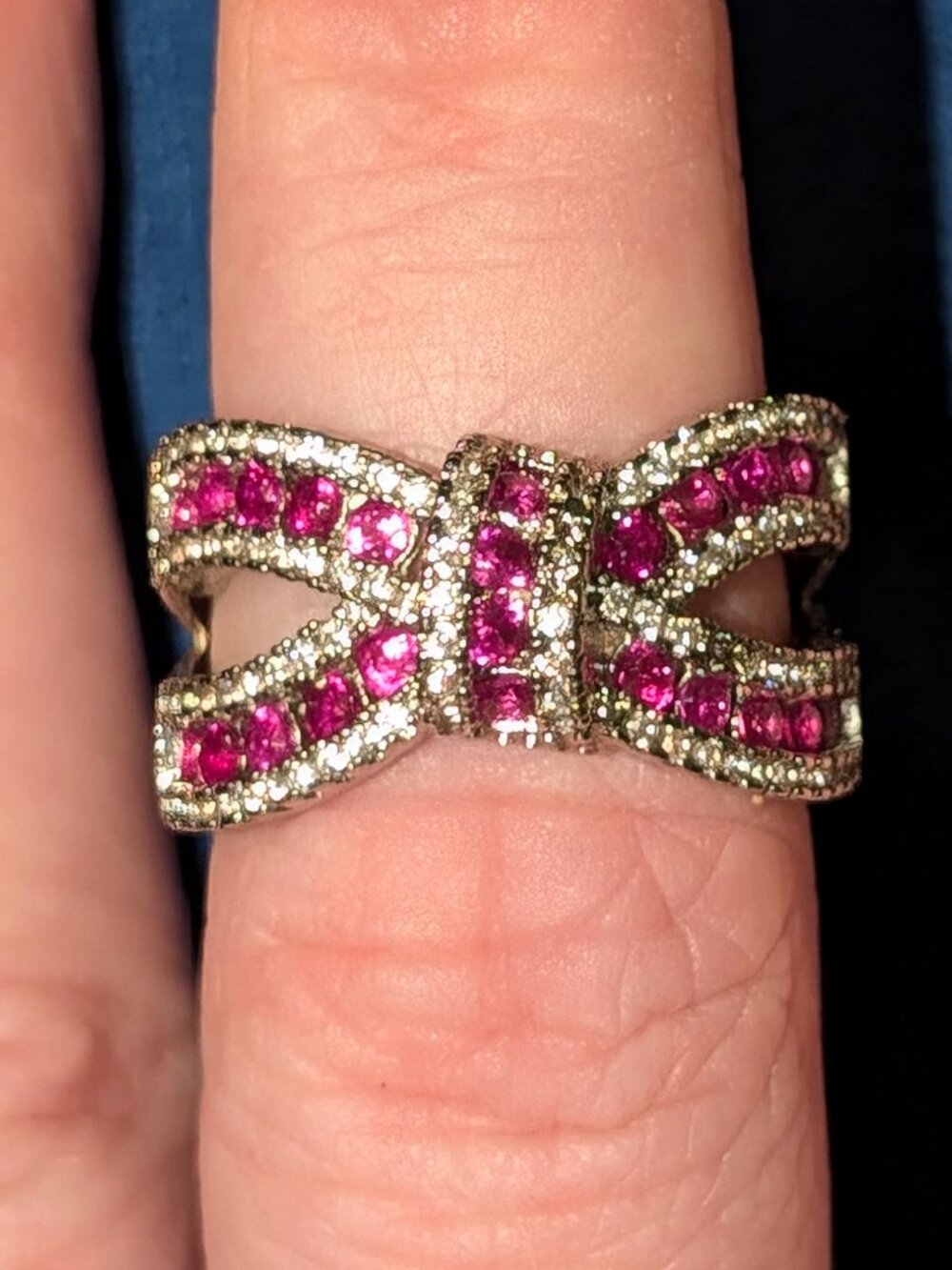 Platinum sterling silver ruby bow diamond ring
